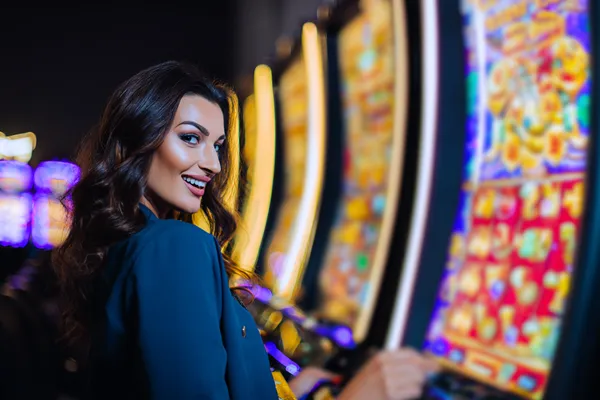 A close-up shot of golden coins falling around a spinning roulette wheel, representing immersive casino action at AMJILI.